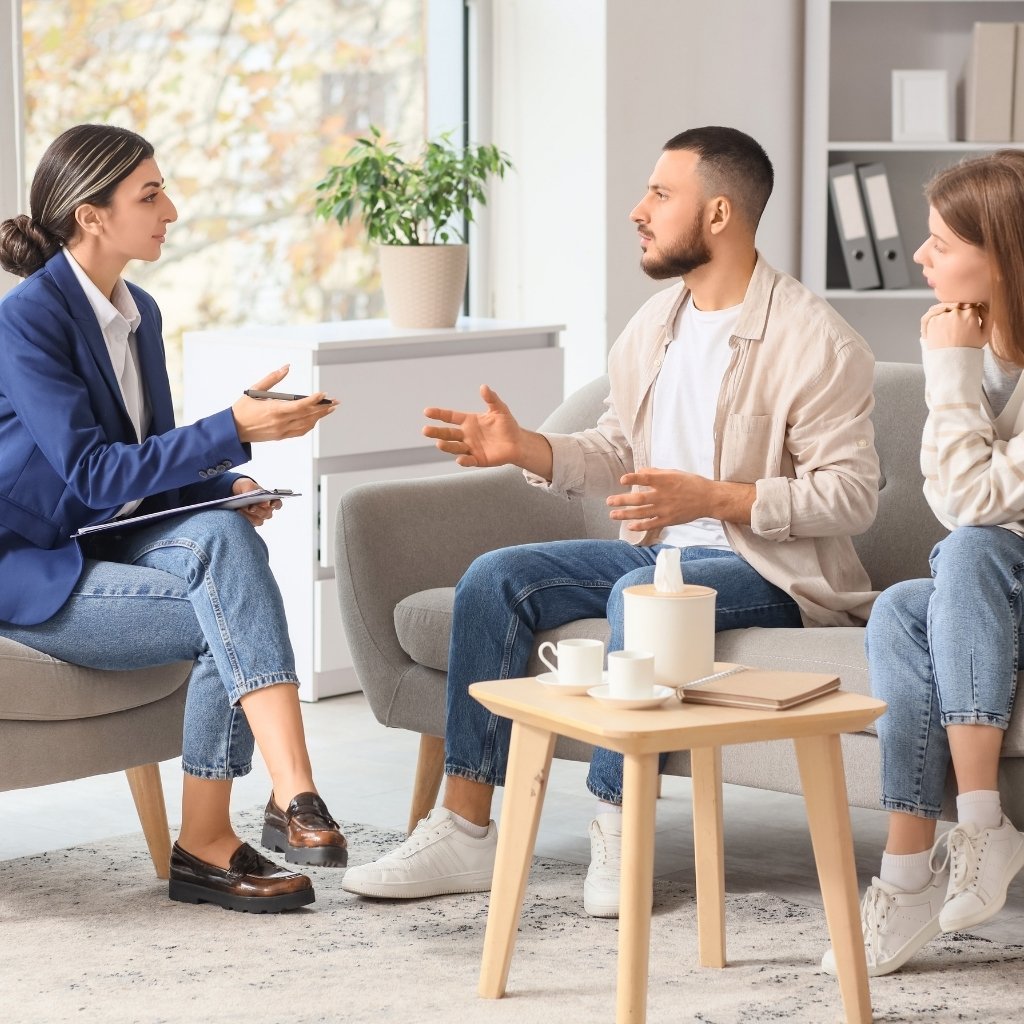 Individuals participating in a calm and respectful mediation session.